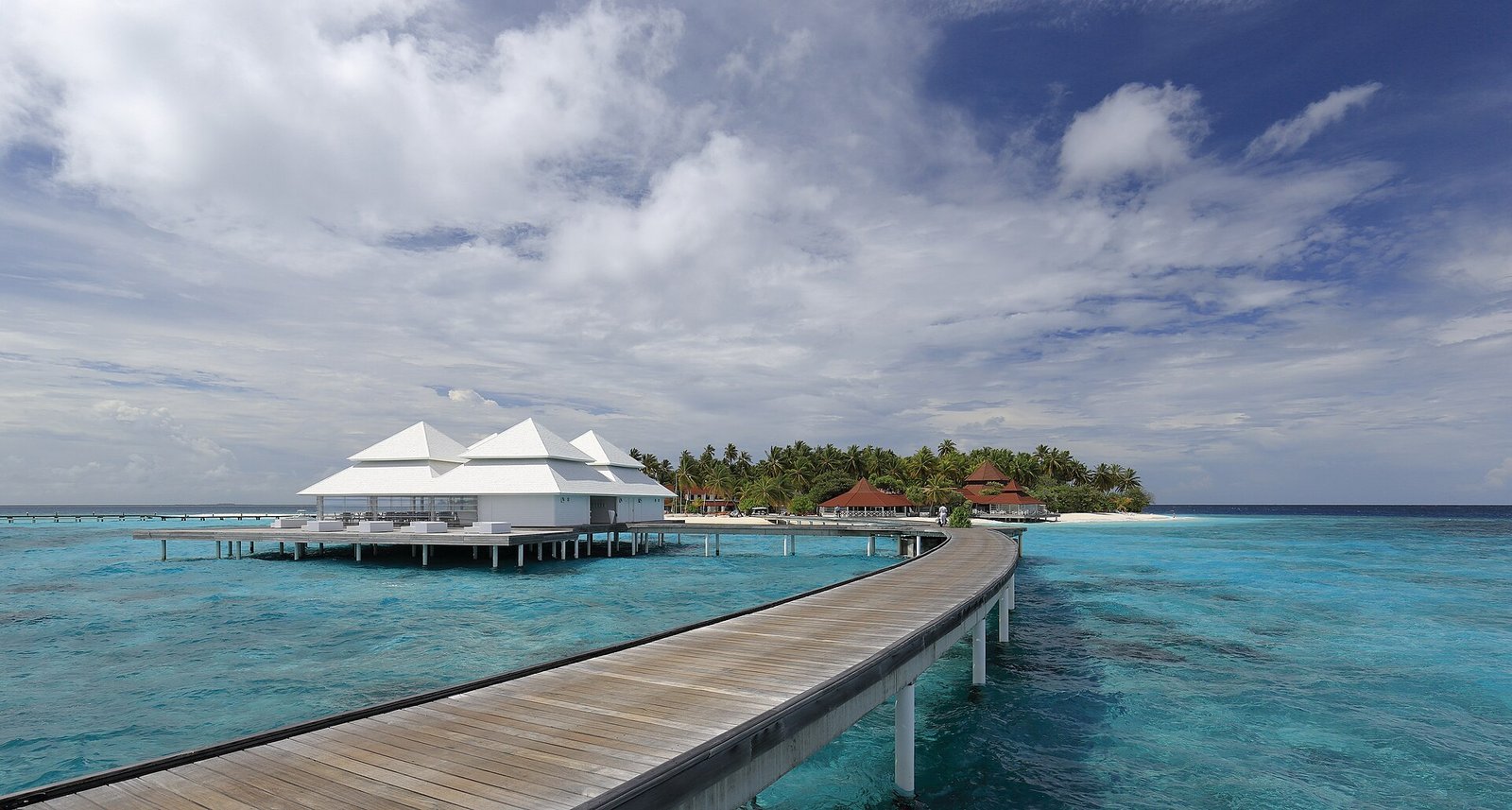 Wooden jetty leading to overwater villas in the Maldives