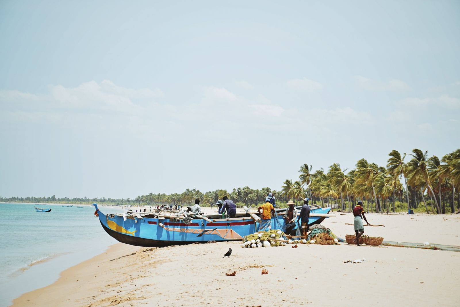 Fishermen unloading their catch on Kalkudah beach