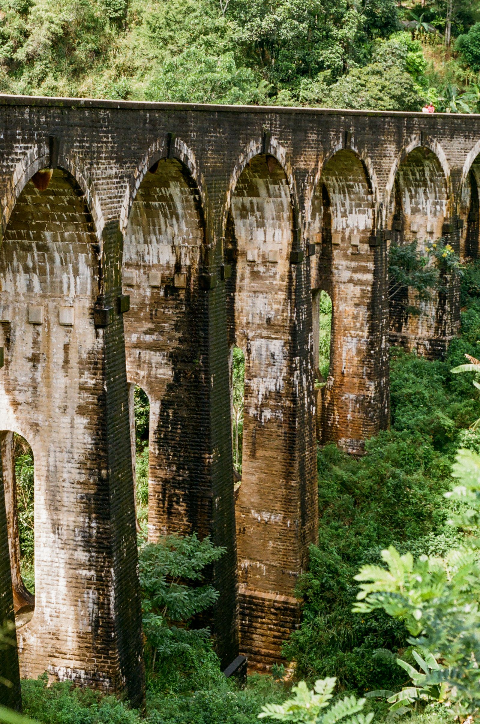 The Nine Arch Bridge amidst lush greenery in Ella, Sri Lanka The Nine Arch Bridge amidst lush greenery in Ella, Sri Lanka