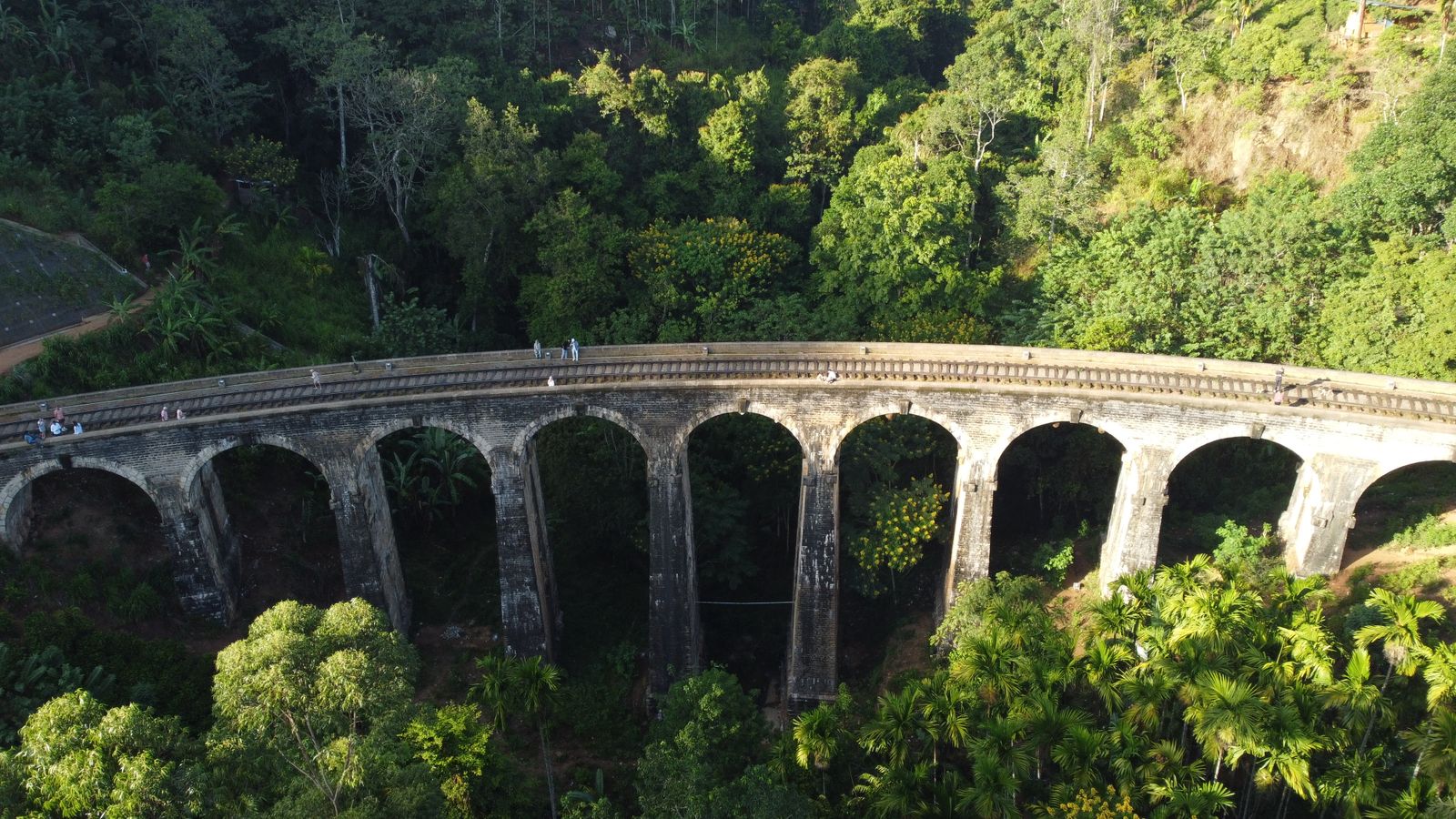 Aerial view of the Nine Arches Bridge amidst green forest in Ella, Sri Lanka Aerial view of the Nine Arches Bridge amidst green forest in Ella, Sri Lanka